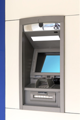Bankautomat an einer Hauswand